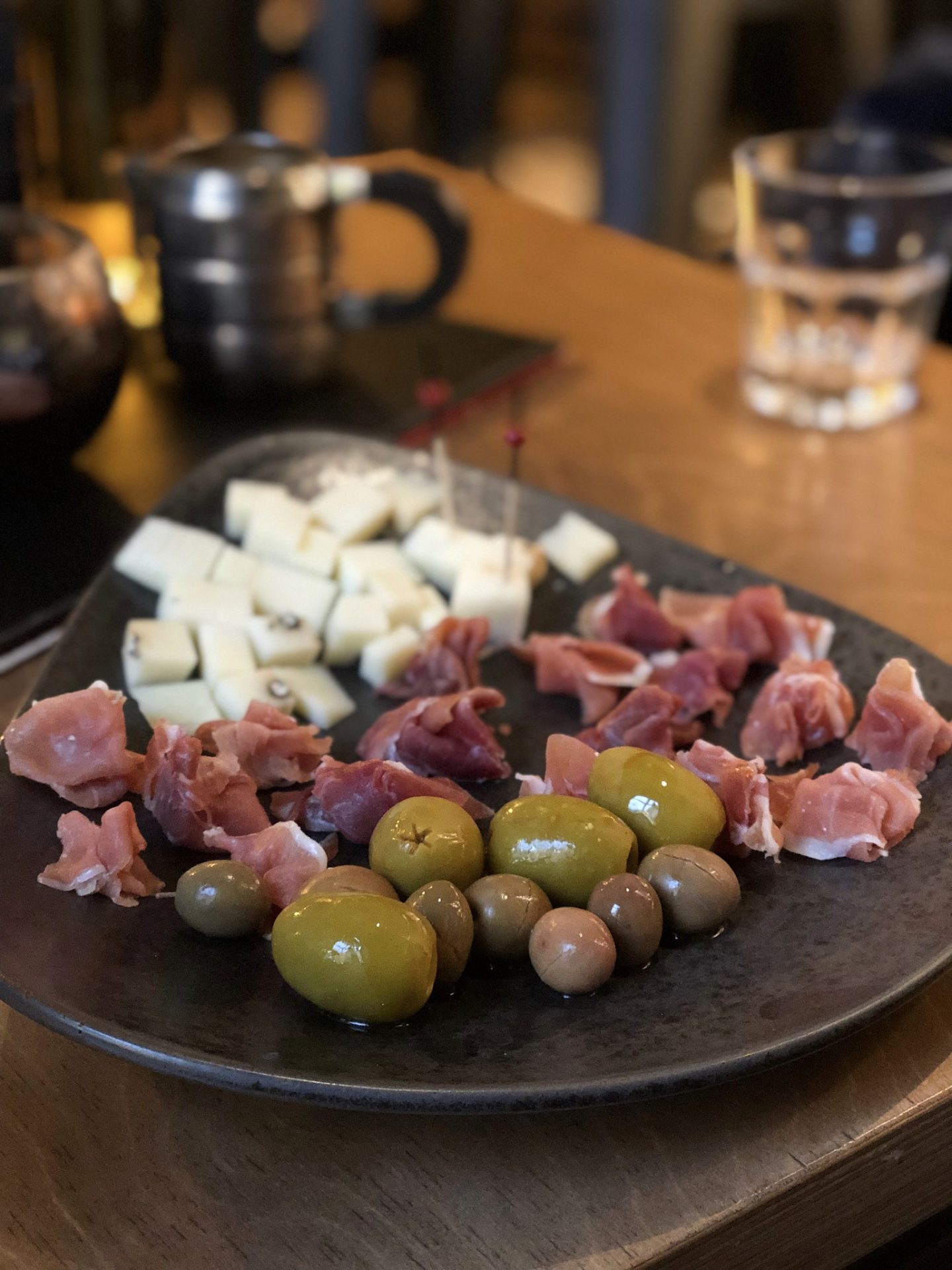 vilnius bars: a platter of cheese, ham and olives