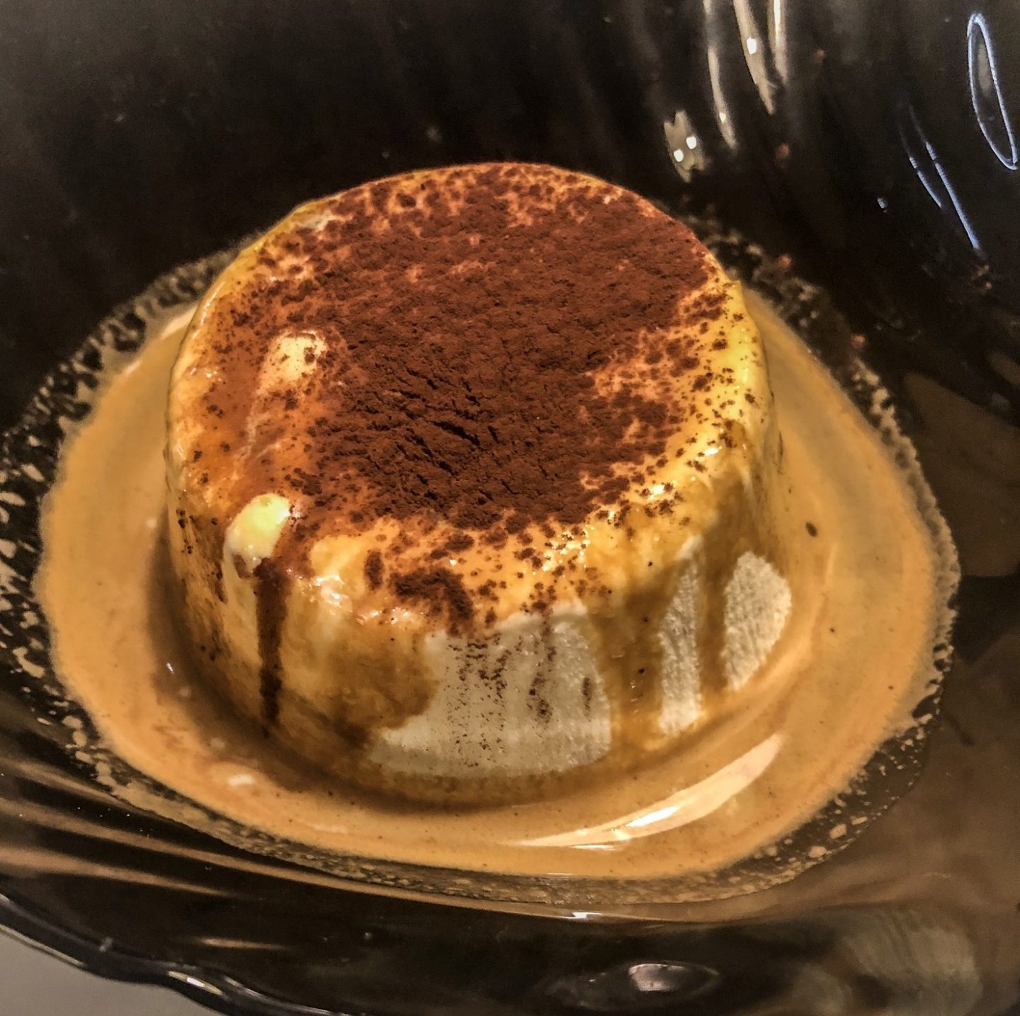 Eating affrogato vanilla gelato with espresso and a chocolate dusting in trento trentino