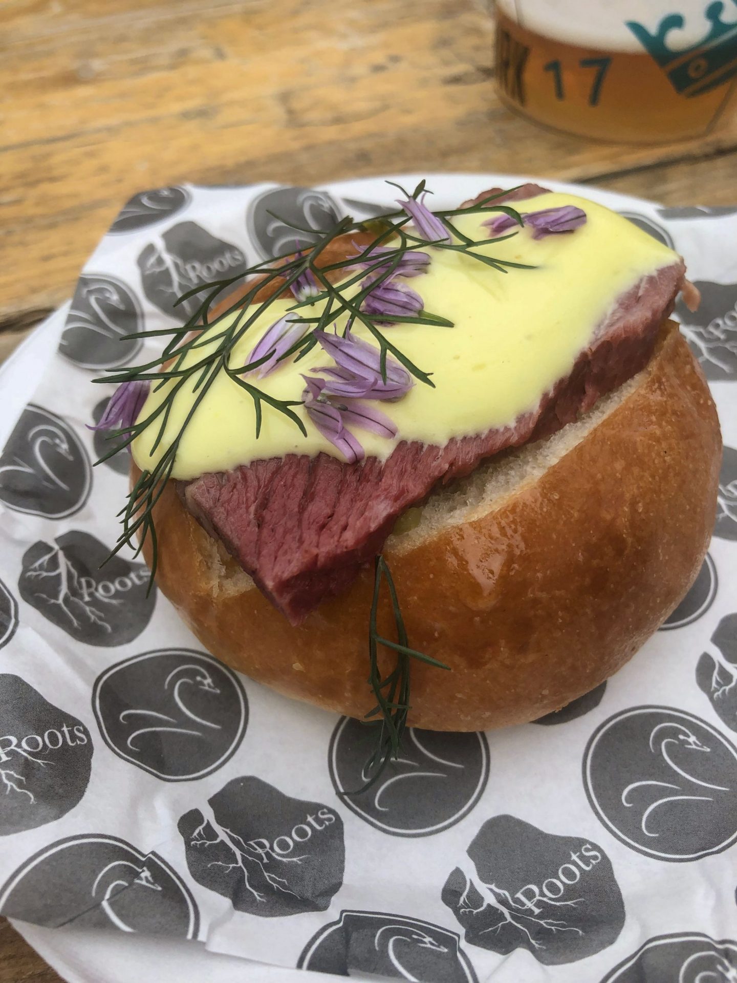 Beautifully presented bao bun with colourful flowers on top at Pub in the Park 2019