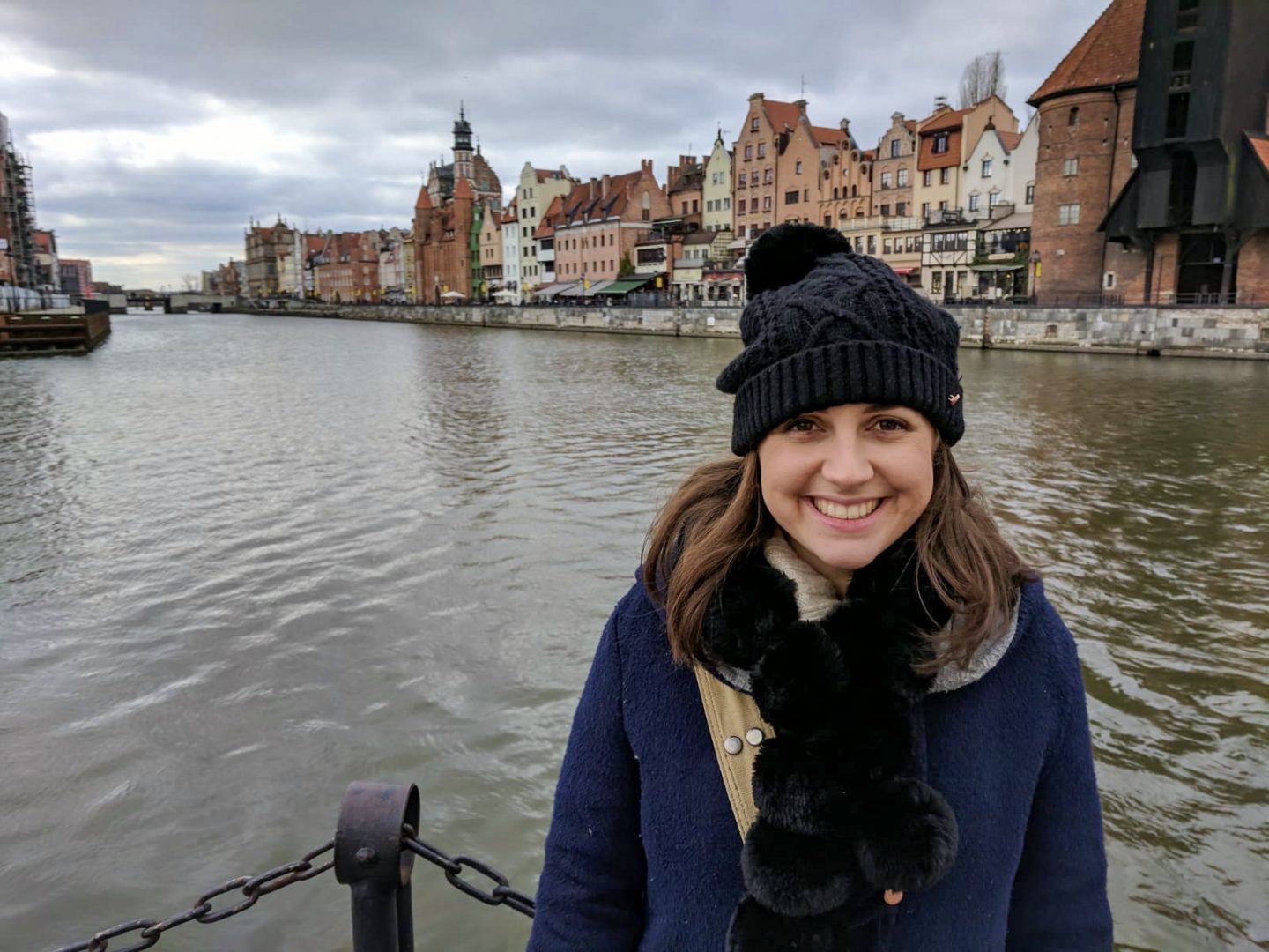 Girl smiling directly into the camera on a cheap city break in Gdansk