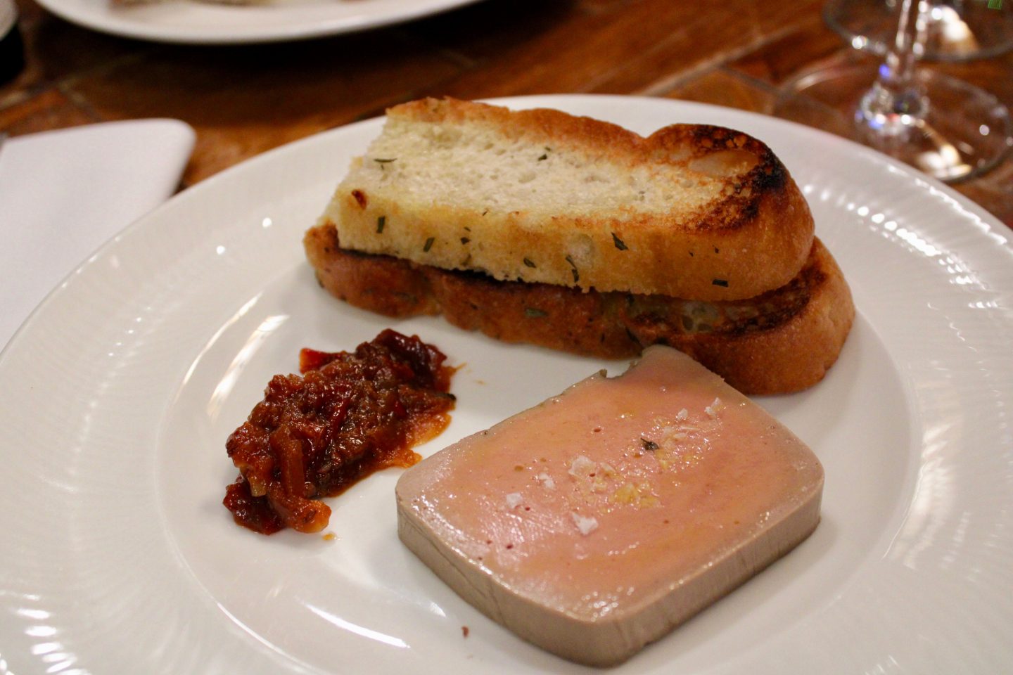 best things to do in Liverpool: a white plate topped with paté and bread