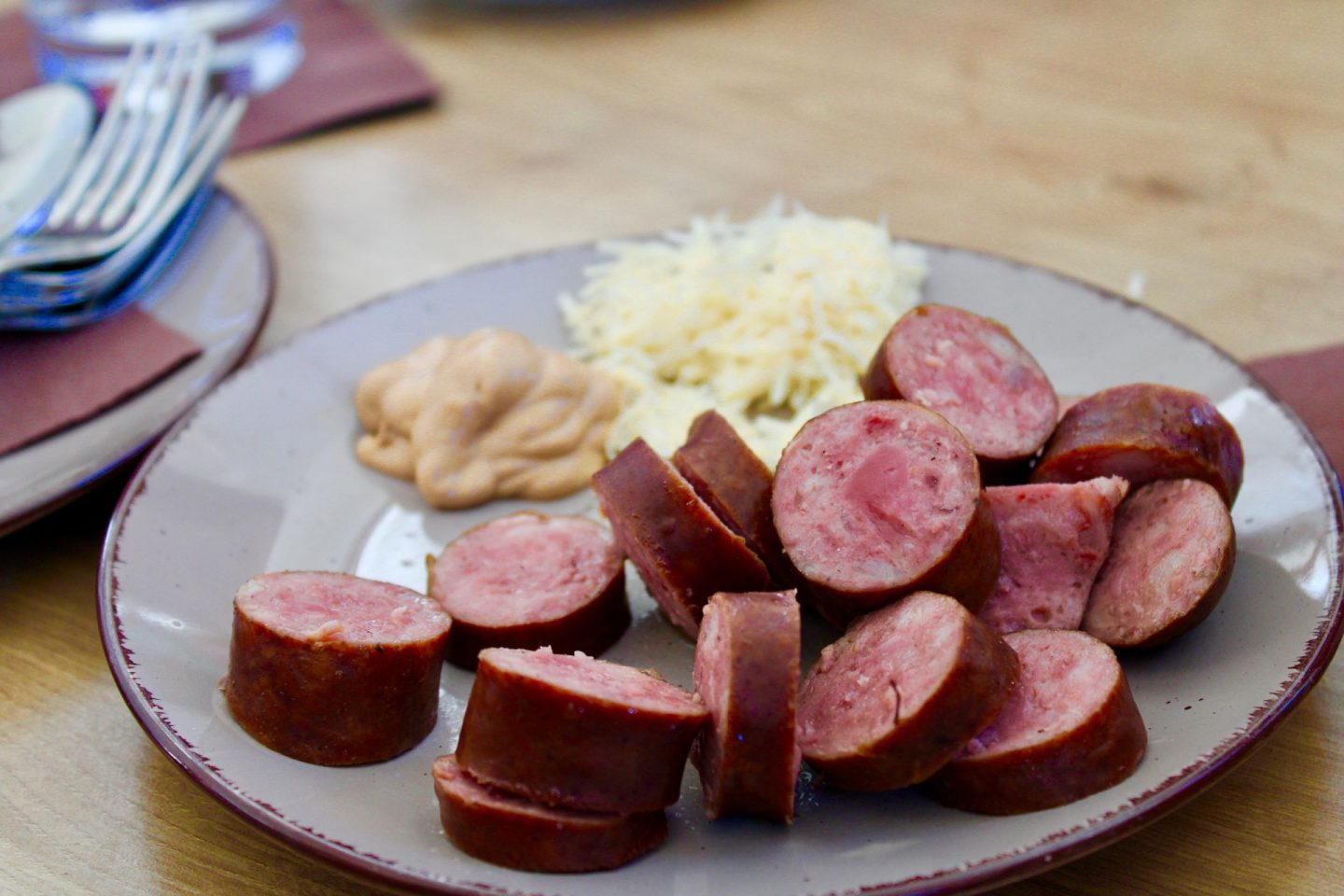 24 hours in Ljubljana food & wine: traditional slovenian sausage with grated horseradish and slovenian mustard
