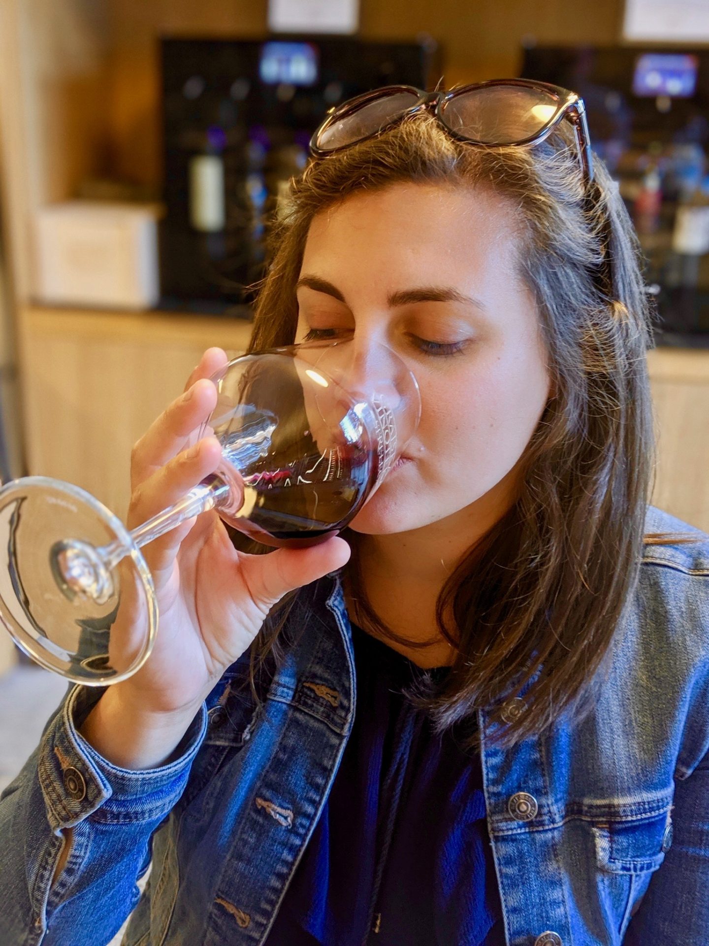 24 hours in Ljubljana food & wine: Nell tasting a glass of red wine at Strelec wine bar at Ljubljana castle