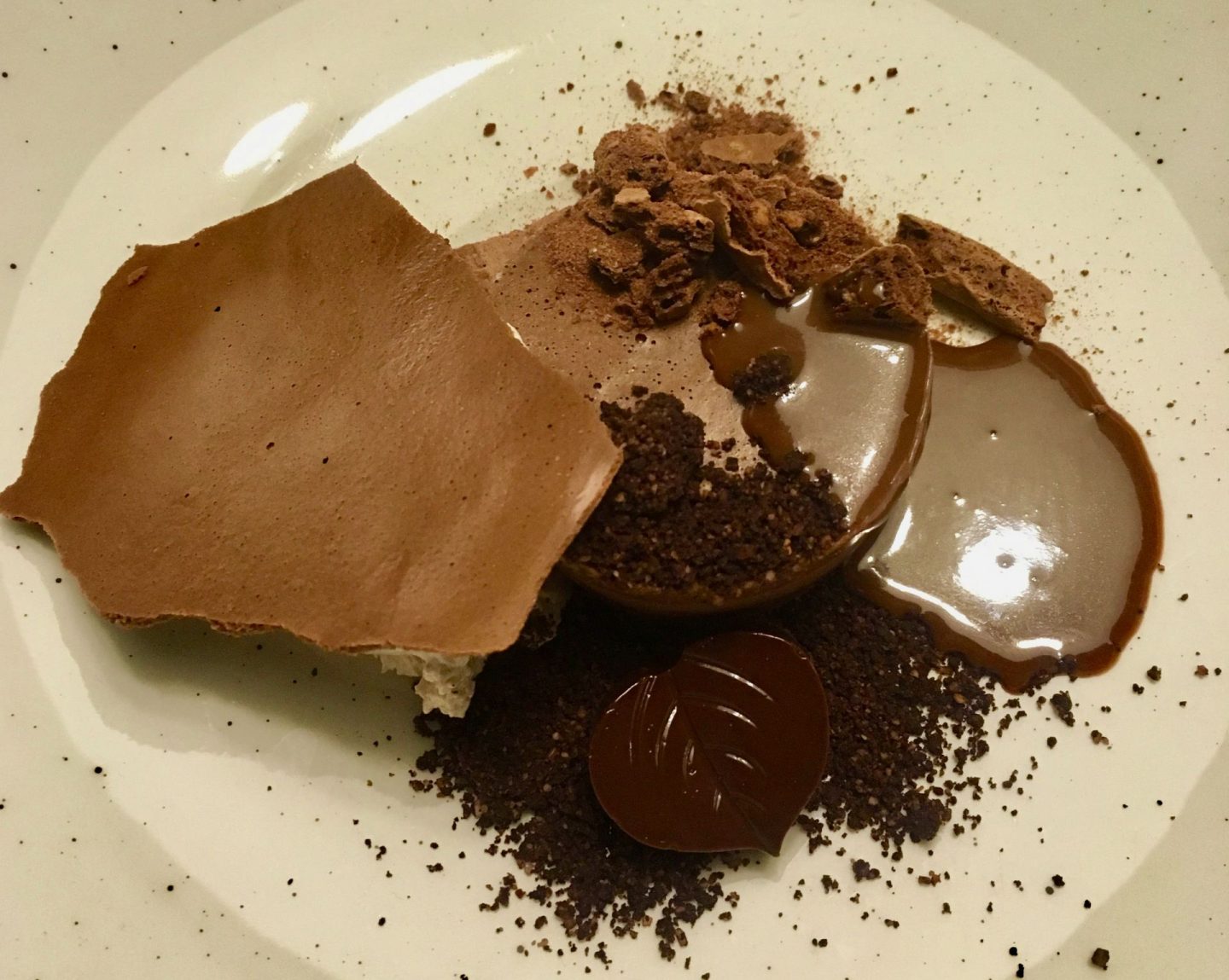 A close up of a chocolate dessert showing different textures of chocolate, eaten at Baracca in Cluj