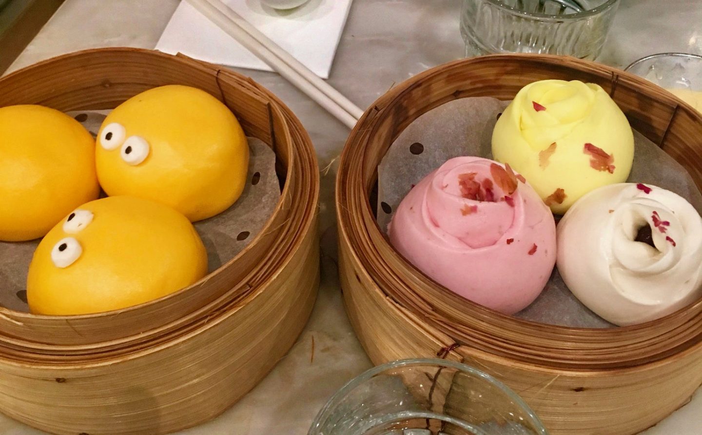Custard buns made to look like little yellow creatures with googly eyes, and rose shaped rose buns, some of the best food in Hong Kong