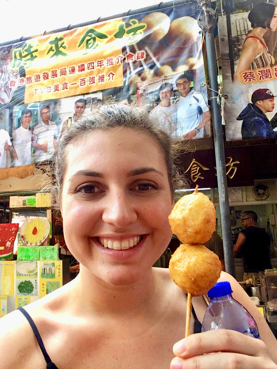 Nell eating fish balls, some of the best food in Hong Kon