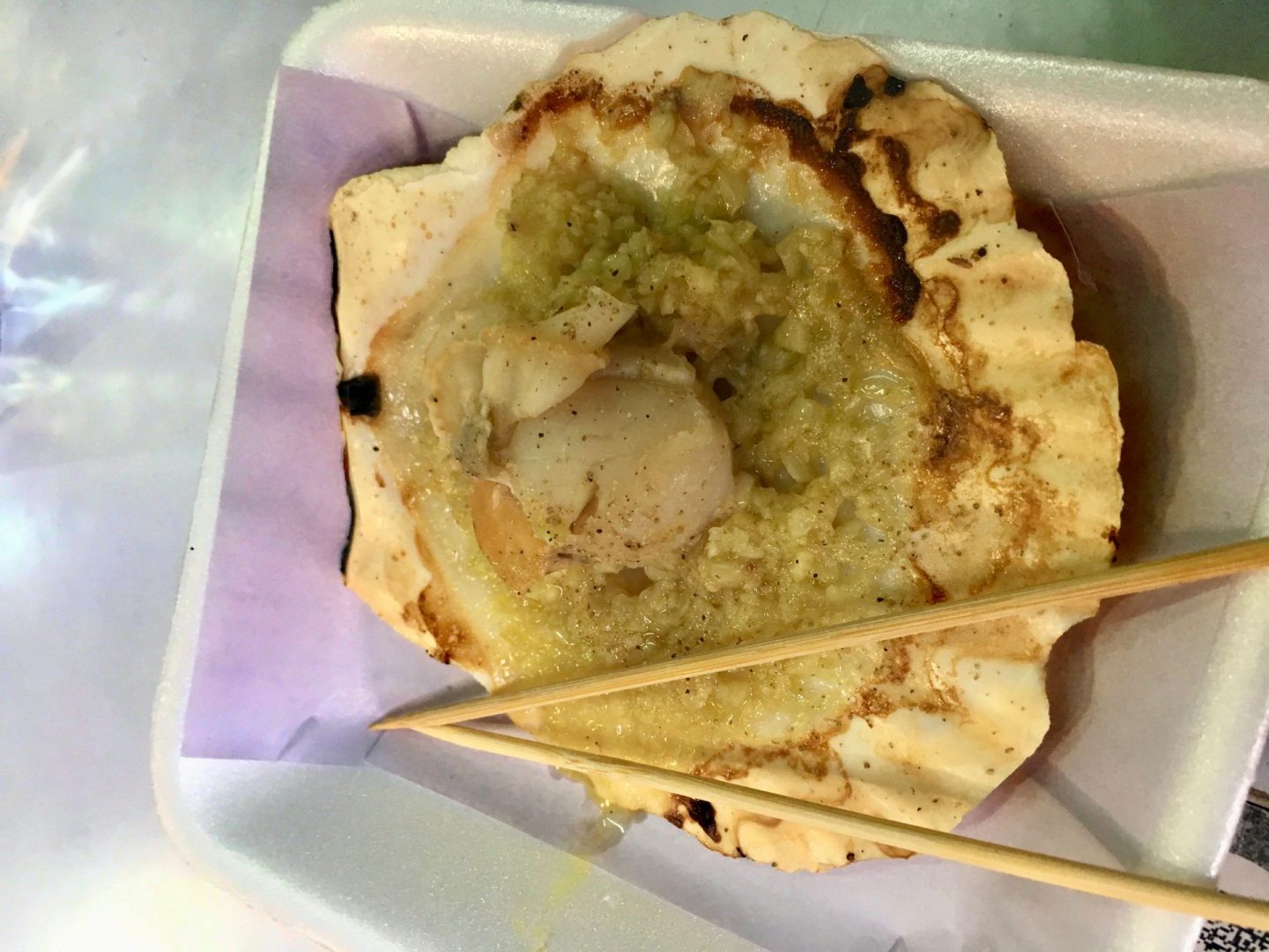 A scallop covered in garlic, best food in Hong Kong eaten in Tai O