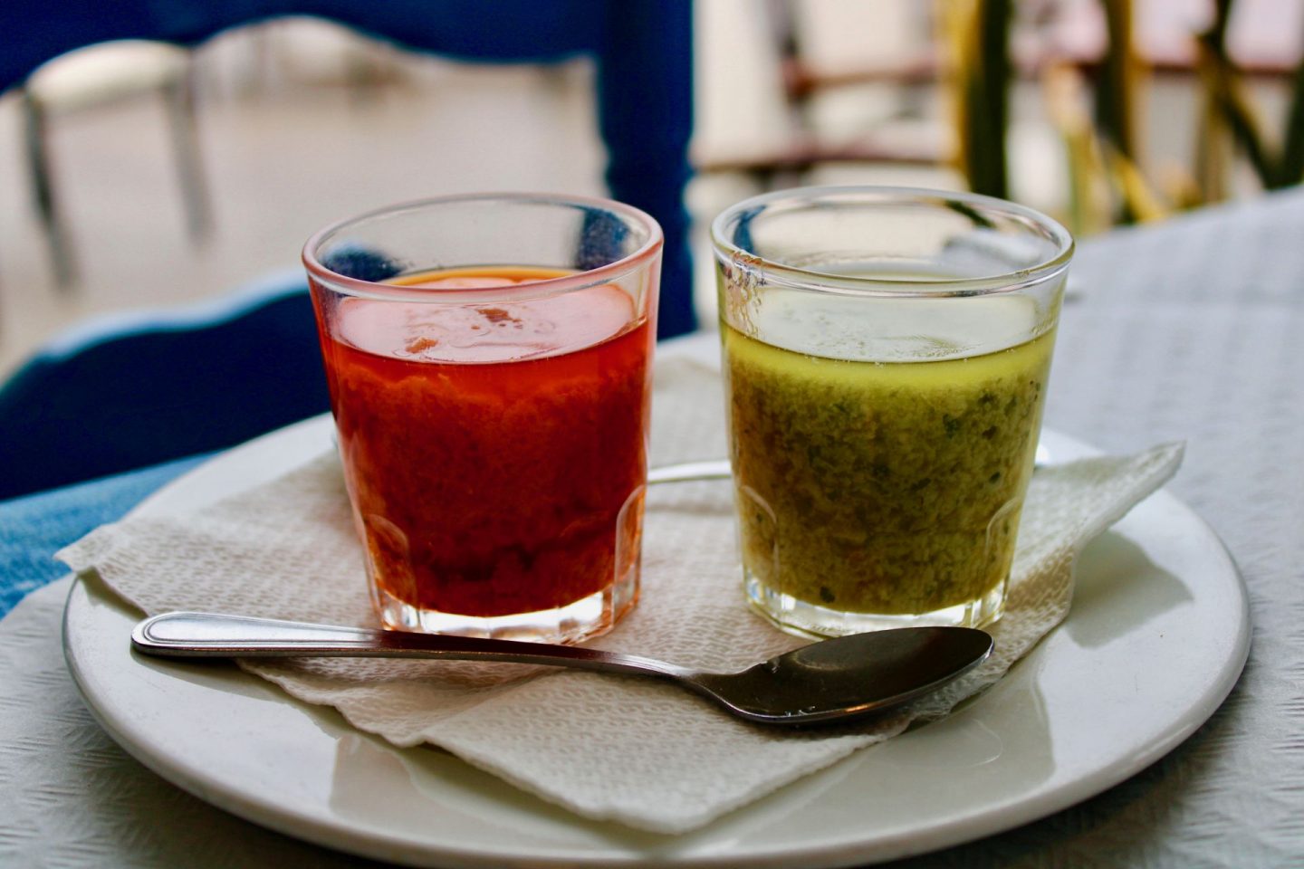 Things to do in Lanzarote: red and green mojo sauce served in shot glasses with a teaspoon next the them