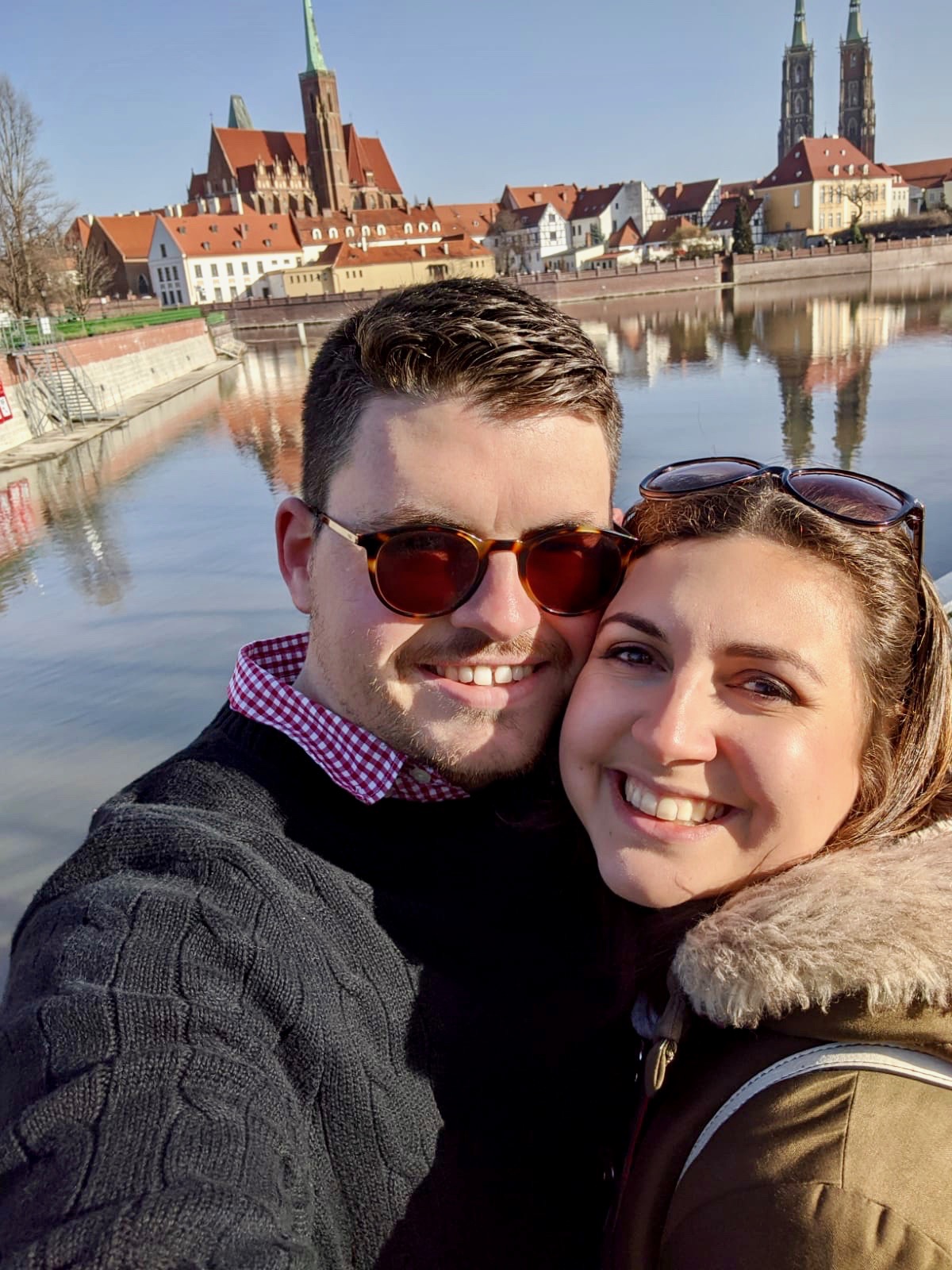 Practising gratitude during coronavirus: Nell and her boyfriend smiling at the camera, taken in Wroclaw in Poland